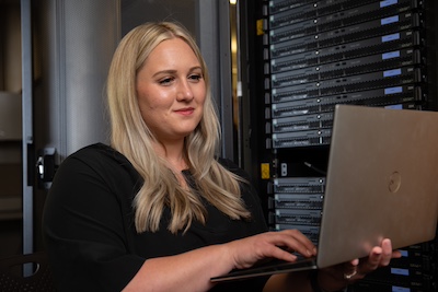 woman sitting in front of a laptop
